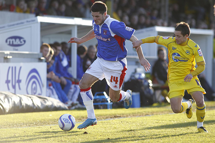 Torquay v Carlisle: Carlisle's Ben Marshall and Torquay's Danny Stevens battle for the ball