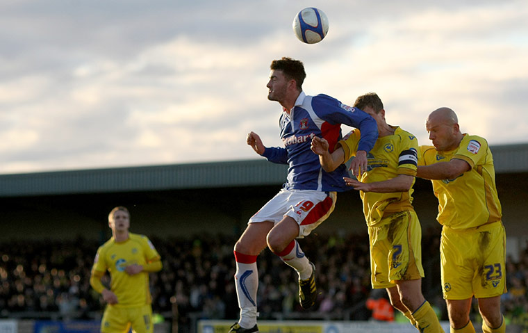 Torquay v Carlisle: Carlisle's Danny Stevens beats Torquay's Frank Smiek to the ball