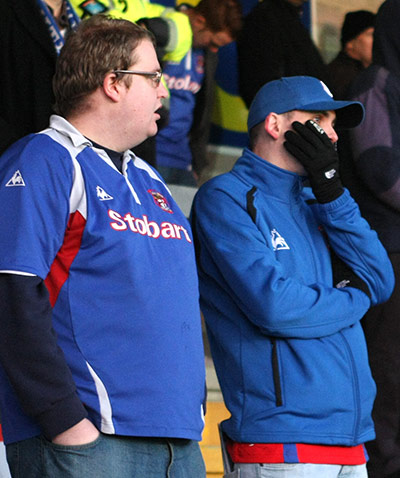 Torquay v Carlisle: A Carlisle United supporter yawns 