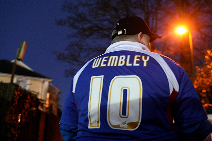 Torquay v Carlisle: A Carlisle United supporter with 'Wembley' on the back of his shirt
