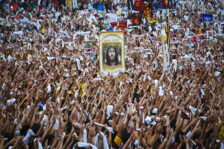24 hours: Manila, Philippines: Catholic devotees in the procession of Black Nazarene