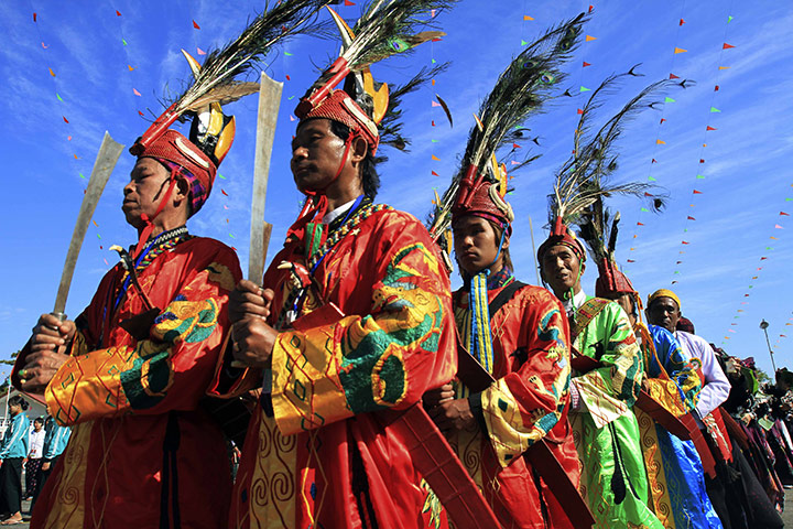 24 hours: Myitkyina, Burma: Kachin people dance during their Manaw festival