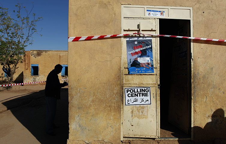 24 hours: Deyoum, Sudan: An SSRC observer writes notes by a polling station 