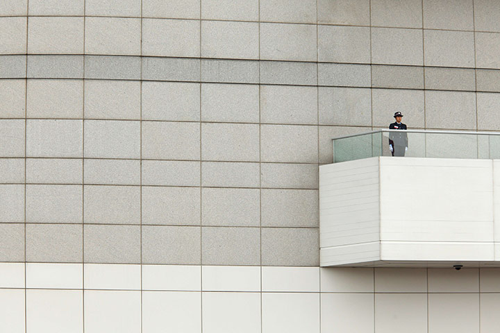 24 in pictures: A policewoman stands guard as part of China's National Day celebrations
