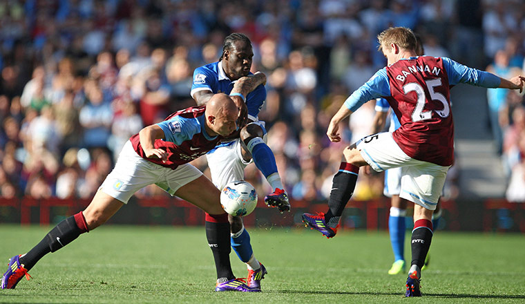 Saturday Roundup: Aston Villa's Alan Hutton and Barry Bannan tackle Wigan's Victor Moses 