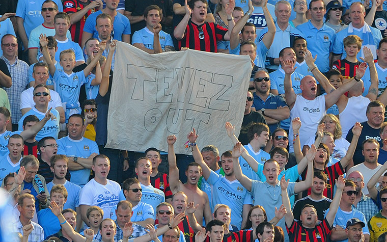 Saturday Roundup: Manchester City fans hold a banner stating Tevez out