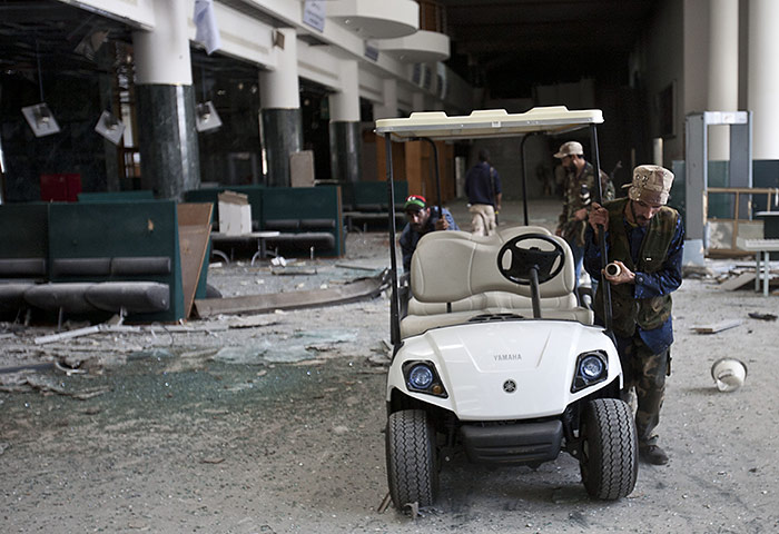 Sirte by Peter Beaumont: NYC fighters liberating a golf cart inside the Ougoudougou centre