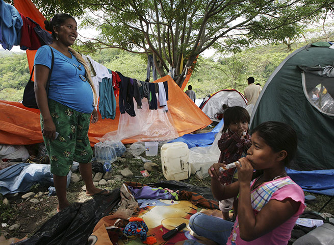Bolivia Tipnis protests: B8 October: Bolivian indigenous people est near their tents at Caranavi