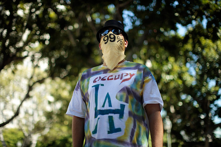 24 hours: Los Angeles, California: A man wears an Occupy LA t-shirt at protest camp