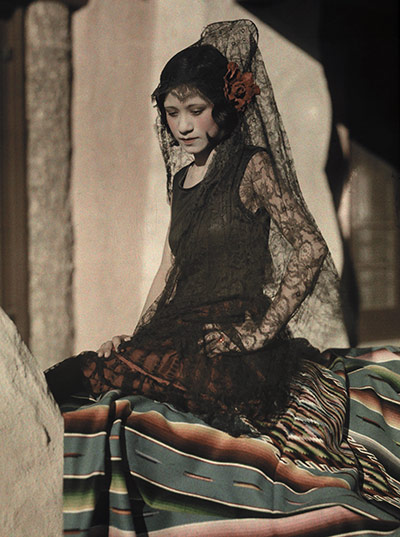 The history of lace: A young Mexican woman poses in a black mantilla costume, 1928