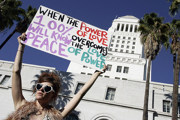 Occupy protests: Los Angeles: Jessica O'Donnell holds a sign at the Occupy LA protest