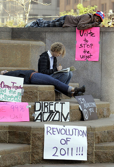 Occupy protests: Cleveland: Members of the group Occupy Cleveland rest on Public Square