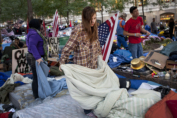 Occupy protests: New York: A woman folds blankets in the Occupy Wall Street protests 
