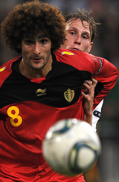 Euro 2012 Qualifiers: Belgium's Marouane Fellaini vies with Germany's Benedikt Hoewedes