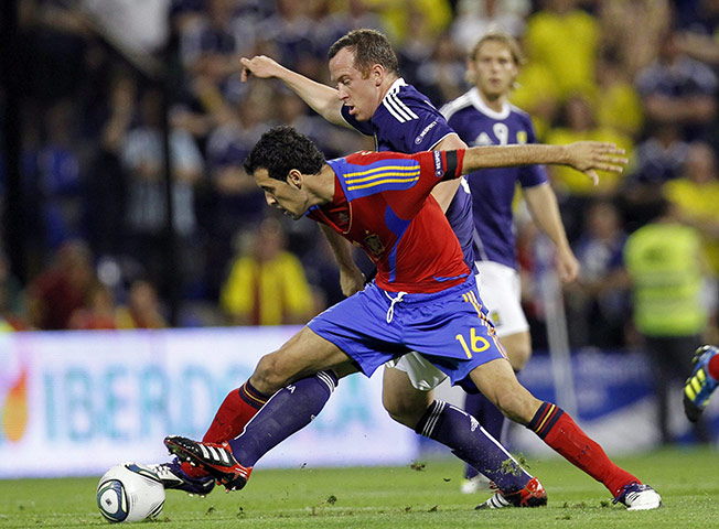 Euro 2012 Qualifiers: A midfield tussle between Sergio Busquets and Charlie Adams