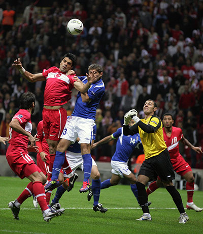 Euro 2012 Qualifiers: Turkey's Gokhan Zan tussles with Azerbaijan's Vurghun Huseynov