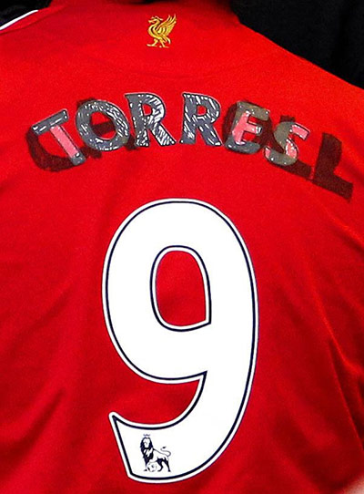 John Henry Timeline: A Liverpool fan wear's a Fernando Torres/Andy Carroll shirt