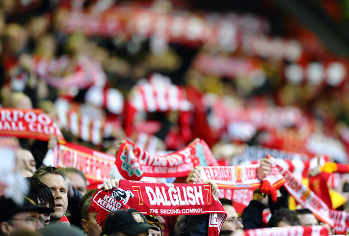 John Henry Timeline: Liverpool supporters hold scarves showing Kenny Dalglish's name