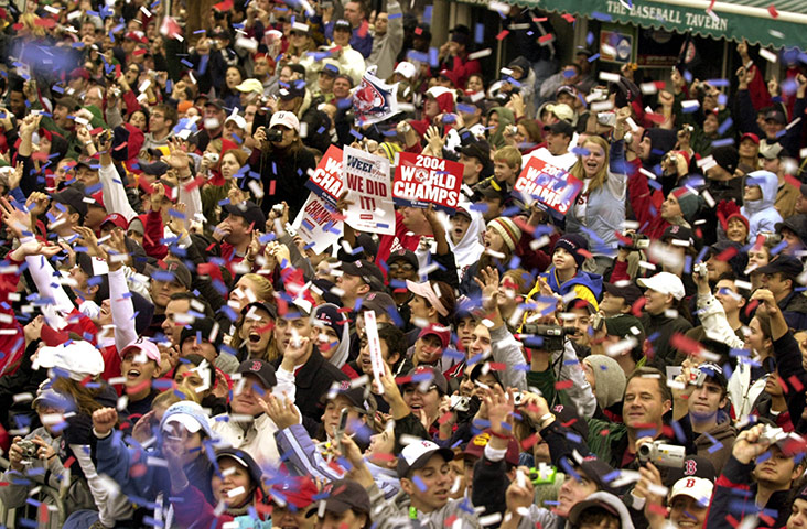 John Henry Timeline: Crowds cheer during the 2004 World Series Victory parade