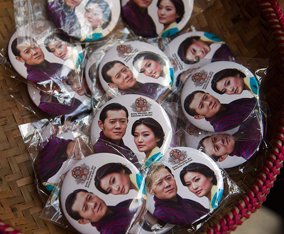 Bhutanese royal wedding: Souvenir badges on sale at a crafts fair