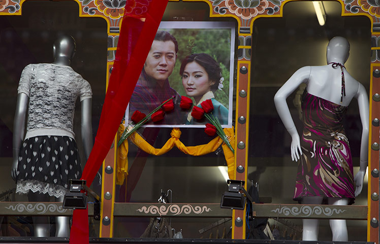 Bhutanese royal wedding: A dress shop displaying a portrait