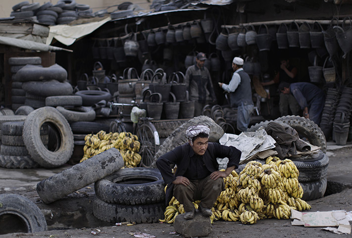 Afghan-vendor-sits-next-t-001.jpg