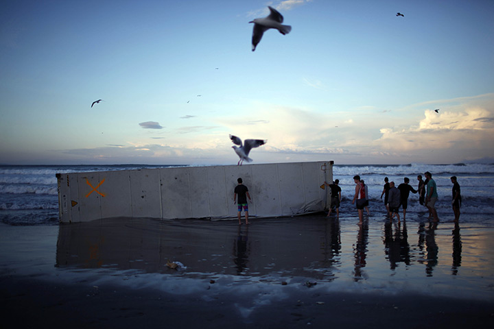 24 hours in pictures: Container from ship Rena on Mount Maunganui beach