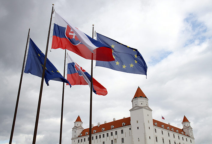 Week in Business: Flags of Slovakia and European Union wave in front of Bratislava Castle 
