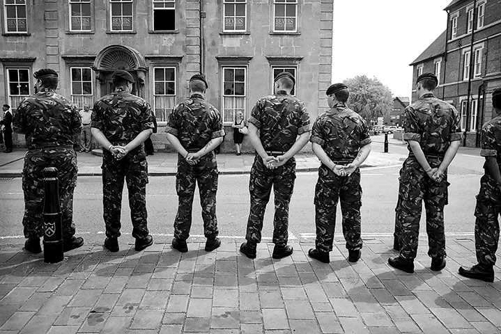 Wootton Bassett: Soldiers line the high street as they wait for a British serviceman