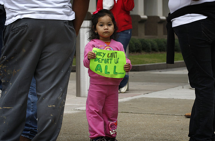 Alabama immigration: Two year-old Angela Cruz takes part in a demonstration