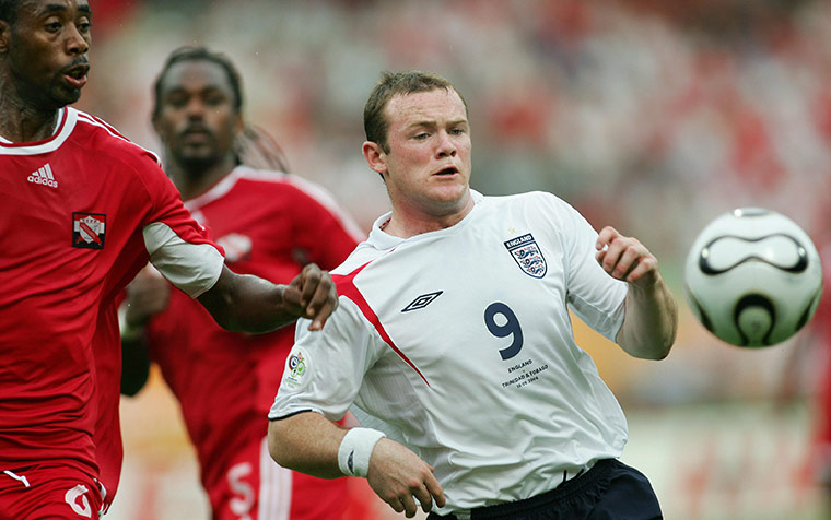 Rooney's tournament woes: England's Wayne Rooney vies with Trinidad & Tobago's Dennis Lawrence