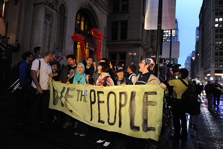 Occupy Wall Street: Occupy Wall Street protesters march down Broadway