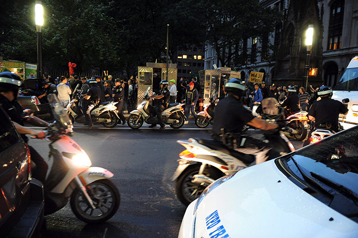 Occupy Wall Street: Police on scooters escort protesters as they march down Broadway