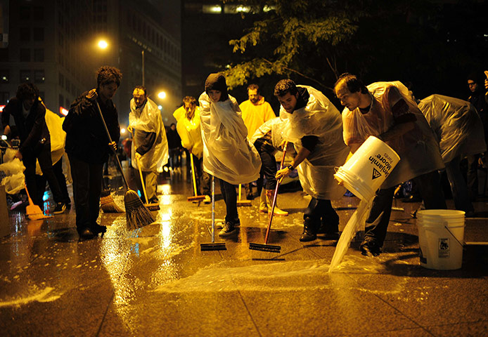 Occupy Wall Street: Protesters spent the night cleaning the park