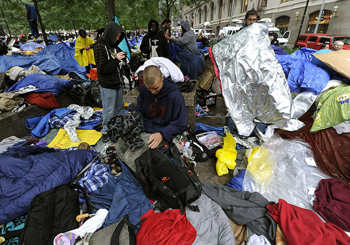 Occupy Wall Street: Demonstrators start cleaning up their belongings
