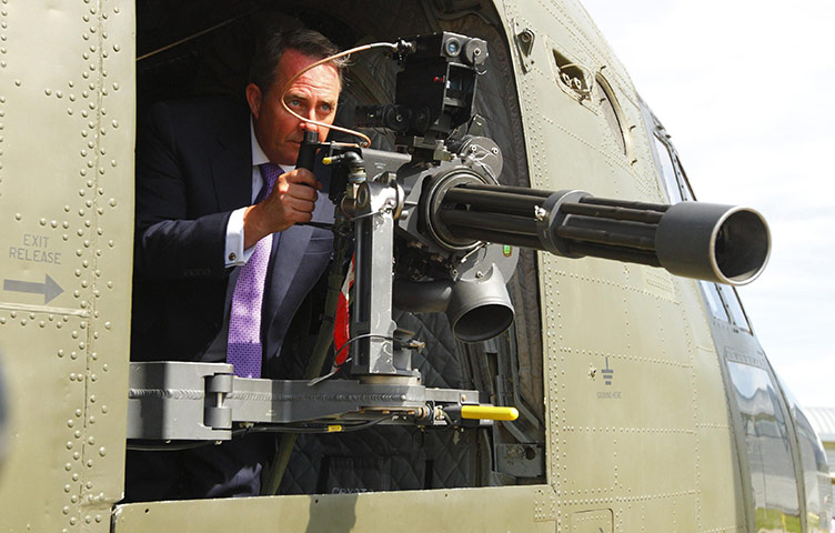 Liam Fox: 22 August 2011: Liam Fox looking through the sights of a machine gun