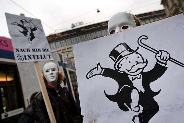 A-masked-protester-hold-a-001.jpg