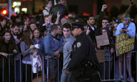 A police officer arrests an Occupy Wall Street protester during a demonstration at Times Square