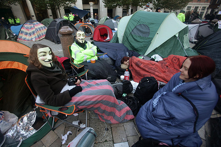 Occupy London protests: Protesters sit outside their tents outside St Paul's Cathedral