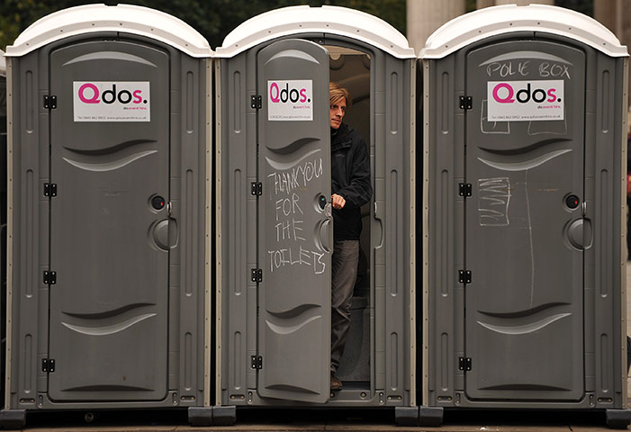 Occupy London Protests: A protester leaves a mobile toilet