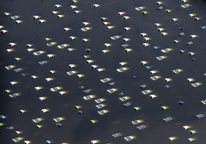 Thailand flooding: Vehicles at a Honda car factory are submerged in floodwaters