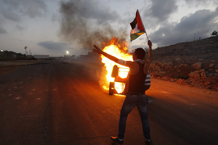 24 hours: Ramallah, West Bank: A Palestinian stone-thrower during clashes