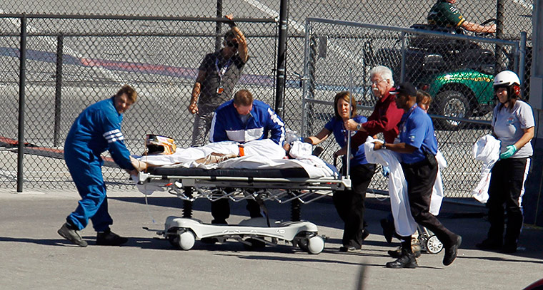 Dan Wheldon Retrospective: Dan Wheldon, of England, is transported to a helicopter following the crash
