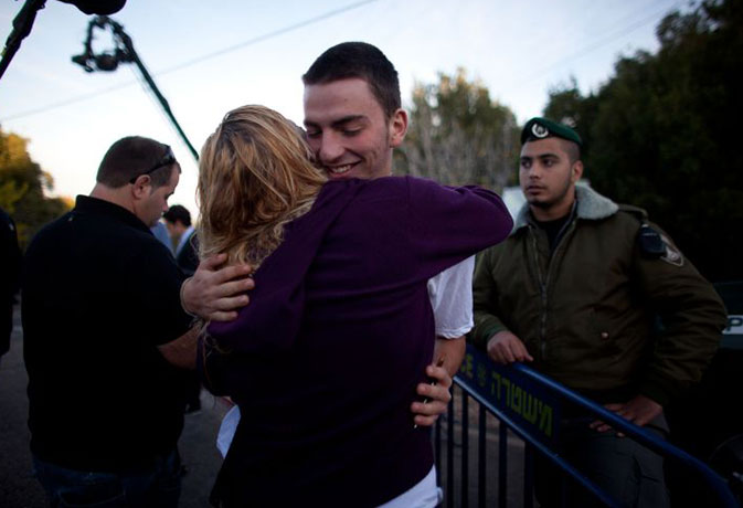 gilad shalit release: Israelis hug outside the house of Gilad Shalit in Mitzpe Hila, Israel