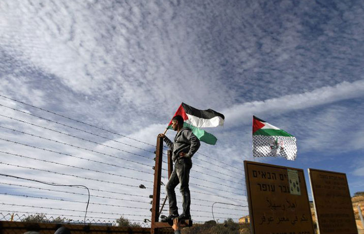 gilad shalit release: A Palestinian man waits at the Beituniya checkpoint near Ramallah