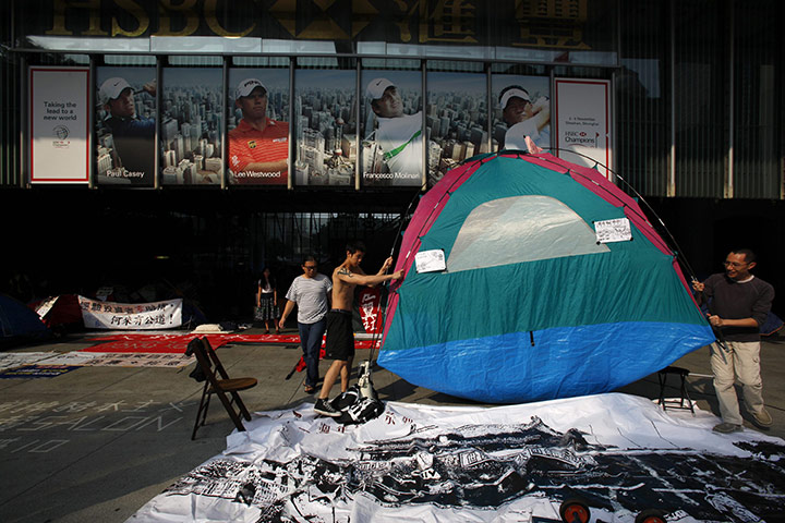 Occupy World Protests: Protesters move a tent during an 