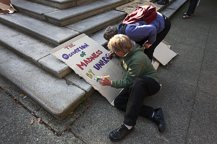Occupy World Protests: Protesters colour signs during the Occupy Vancouver protest