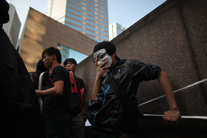 Occupy protests: an activist rests during a protest outside the Hong Kong stock exchange