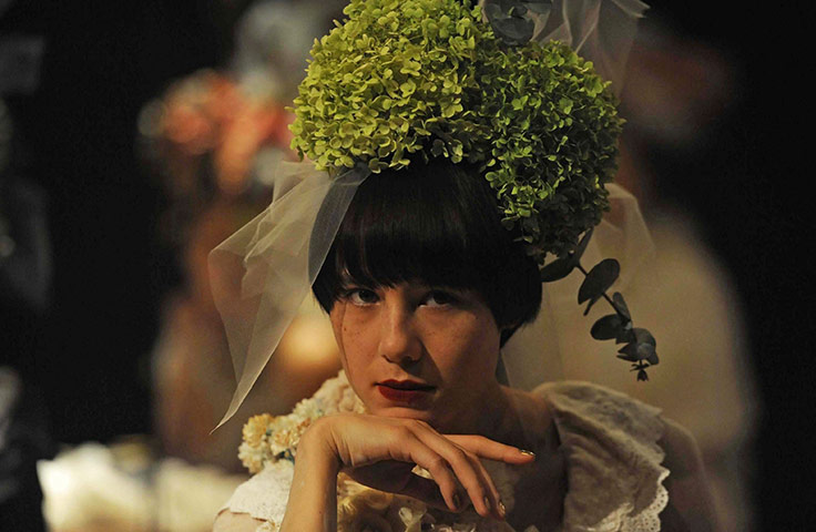 24 hours in pictures: Tokyo, Japan: A model waits backstage before the Koichi Chida show