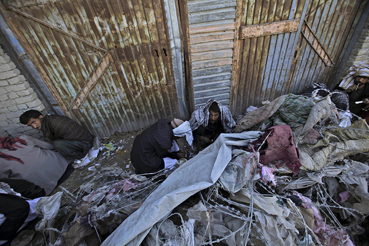 24 hours in pictures: Kabul, Afghanistan: Drug addicts gather in a corner on a roadside